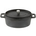 A black pre-seasoned cast iron oval Dutch oven with a lid.