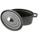 An American Metalcraft pre-seasoned cast iron oval dutch oven with a lid.