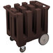 A dark brown Cambro plastic dish dolly with wheels.