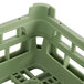 A Vollrath light green plastic dish rack with compartments.