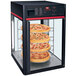 A Hatco FSDT4TCR display rack with pizzas in it.