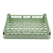 A light green plastic Vollrath dish rack with holes in it.