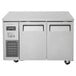 A stainless steel Turbo Air undercounter refrigerator/freezer with two doors.