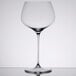 A close-up of a clear Spiegelau Willsberger Burgundy wine glass.