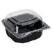 A Polar Pak black plastic hinged take-out container with a clear lid.