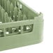 A light green plastic Vollrath dish rack with several holes.