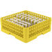 A yellow plastic Vollrath Traex dish rack with four compartments.