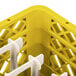 A yellow Vollrath Traex peg rack with white plastic pegs.