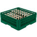 A green plastic Vollrath Traex rack with four compartments.