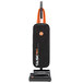 A black and orange Hoover Task Vac commercial bagged vacuum cleaner.