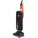A black and orange Hoover Task Vac commercial bagged vacuum cleaner with a handle.