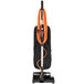 A Hoover Task Vac commercial bagged vacuum cleaner with orange cables.