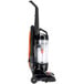A black and orange Hoover Task Vac commercial upright vacuum cleaner on wheels.