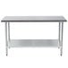 A silver stainless steel Advance Tabco work table with a shelf.