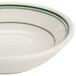 A white bowl with a green band around the rim.