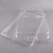 A stack of clear plastic Cambro trays with a hinged lid.
