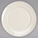 A Homer Laughlin ivory china plate with a white rim on a gray surface.