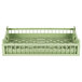 A light green plastic flatware rack with a handle and vent.