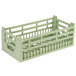 A Vollrath light green plastic dish rack with two shelves.