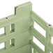 A light green Vollrath dish rack with four compartments.