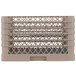 A beige plastic Vollrath Traex plate rack with 15 compartments.