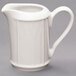 A white Homer Laughlin china creamer with a handle.