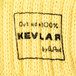 A close up of a yellow knitted Kevlar fabric.