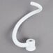 A white plastic coated dough hook for a KitchenAid stand mixer.