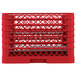 A red plastic Vollrath Traex plate rack with 20 compartments and holes.