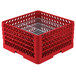 A red plastic Vollrath Traex Plate Crate with metal dividers.