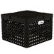 A black plastic Vollrath Traex Plate Crate with 9 compartments and holes.