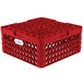 A red Vollrath Traex plate rack with 20 compartments and holes.