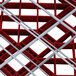 A red and white plastic Vollrath Traex Plate Crate dish rack with a grid of squares and lines.
