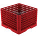 A red plastic Vollrath Traex Plate Crate with a metal grate.