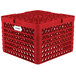 A red Vollrath Traex Plate Crate with holes.