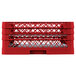A red plastic Vollrath Traex Plate Crate with 44 compartments.
