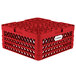 A red plastic Vollrath Traex Plate Crate with compartments and holes.