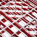 A close-up of a red and white grid with white lines and red squares.