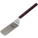 A Mercer Culinary Hell's Handle solid rounded edge turner with a long wooden handle.