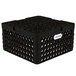 A black plastic Vollrath Traex Plate Crate with 32 compartments and holes.