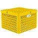 A yellow plastic Vollrath Traex Plate Crate with white label.