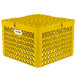 A yellow Vollrath Traex Plate Crate with holes and handles.