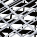 A close up of a white metal grid with white lines.