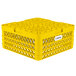 A yellow plastic Vollrath Traex plate rack with compartments and a handle.