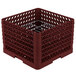 A burgundy plastic Vollrath crate with metal grates.