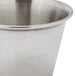 A close up of a Carlisle stainless steel sauce cup.