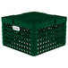 A green plastic Vollrath Traex plate rack crate with 15 compartments.