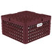 A burgundy plastic Vollrath Traex Plate Crate with 32 compartments.