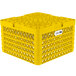 A yellow Vollrath Traex Plate Crate with handles and a white label.
