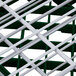 A close up of a green and white metal grid with white bars.